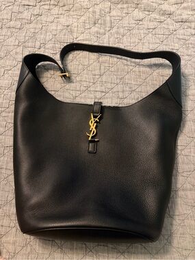 Saint Laurent Black Le 5 A 7 Leather Hobo Bag with Gold YSL Emblem and her baby.